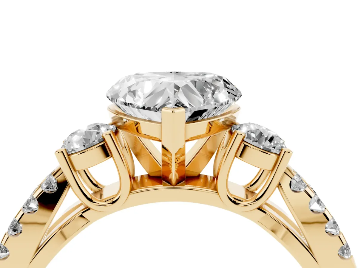 Heart Cut Diamond Three-Stone Ring with Pavé Split Shank and Four-Prong Setting Yellow gold