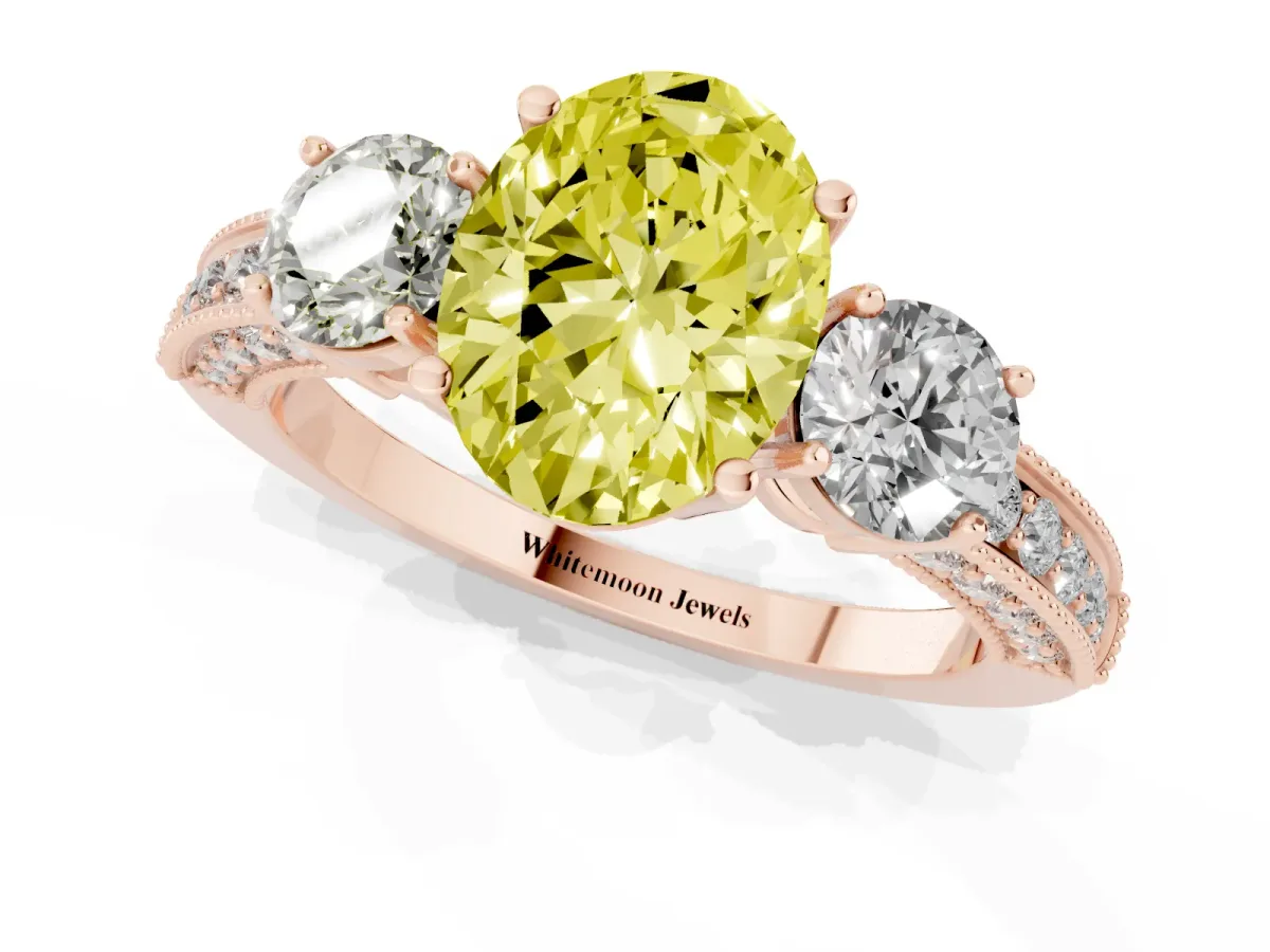 Fancy Yellow Oval Cut Three-Stone Diamond Ring with Pavé Band and Four-Prong Setting Rose gold