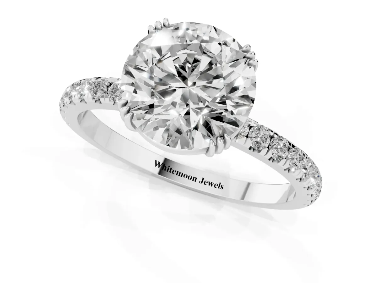 Round Cut Brilliant Solitaire with Pavé Band and Claw Prong Setting Platinum