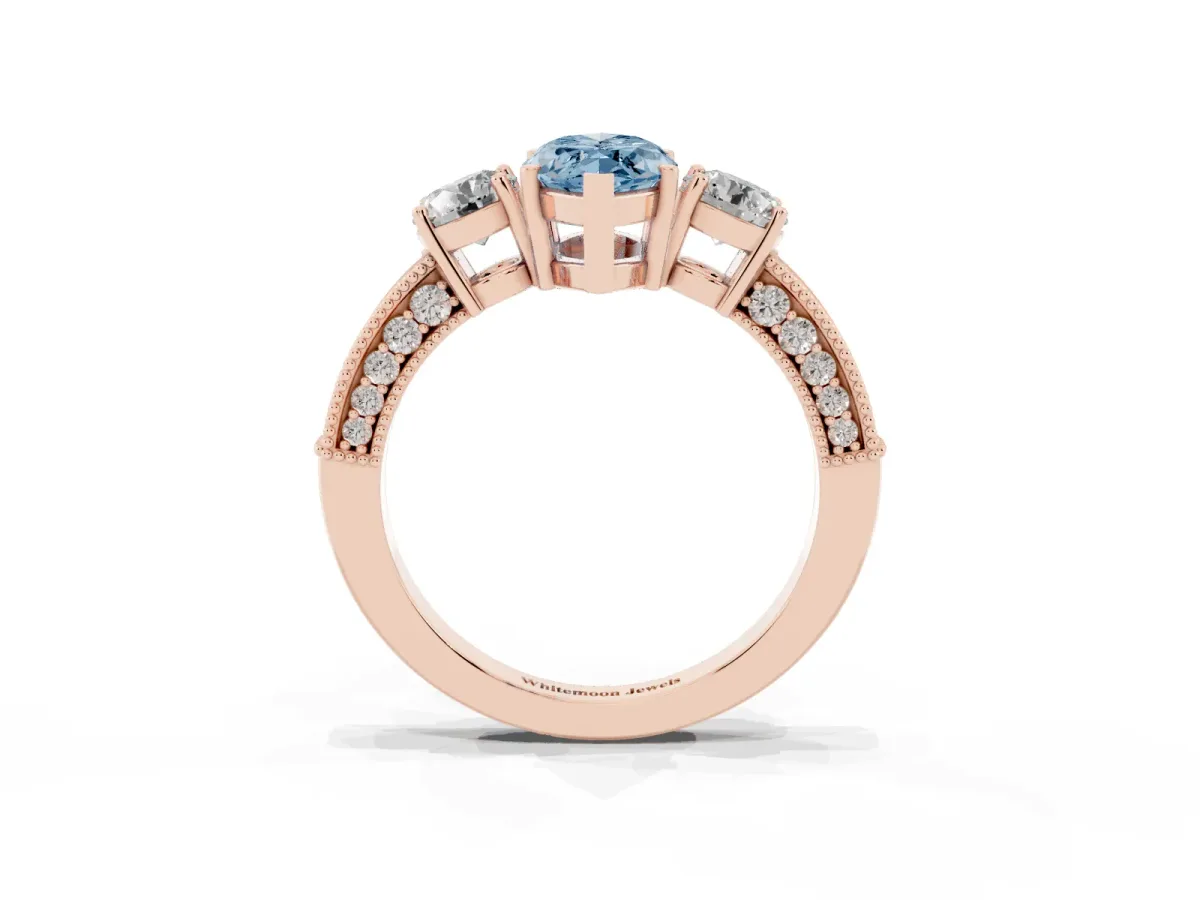 Fancy Blue Marquise Cut Three-Stone Diamond Ring with Pavé Band and Four-Prong Setting Rose gold