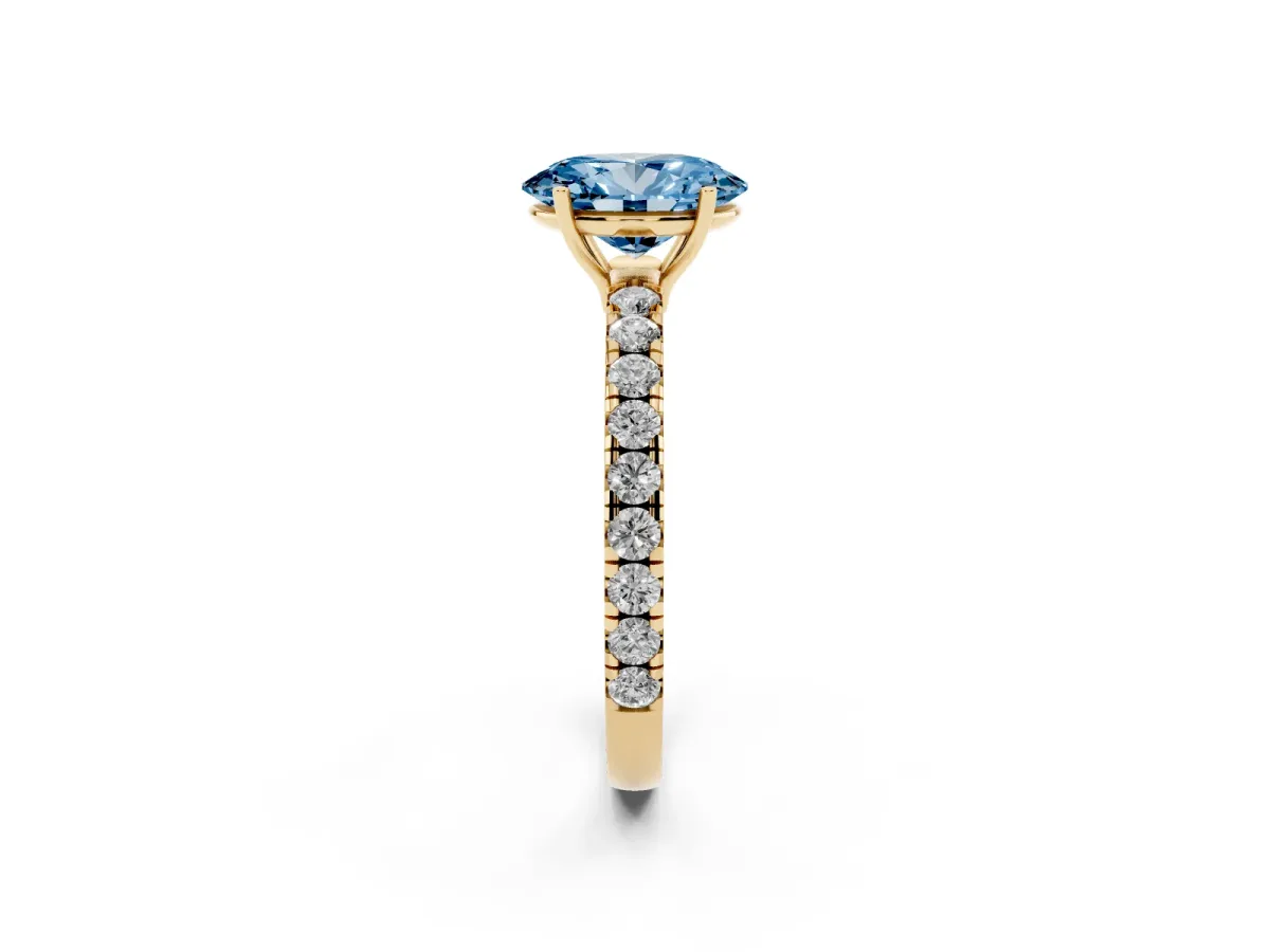 Fancy Blue Oval Cut Diamond Pavé Solitaire Engagement Ring with Four-Prong Setting Yellow gold