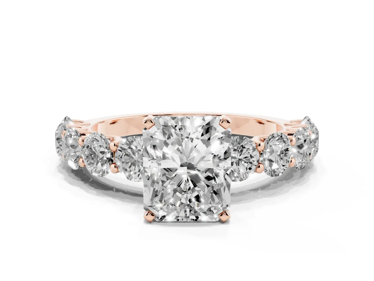 Radiant Cut Diamond Prong Setting with Side Stones on a Pave Band Rose gold