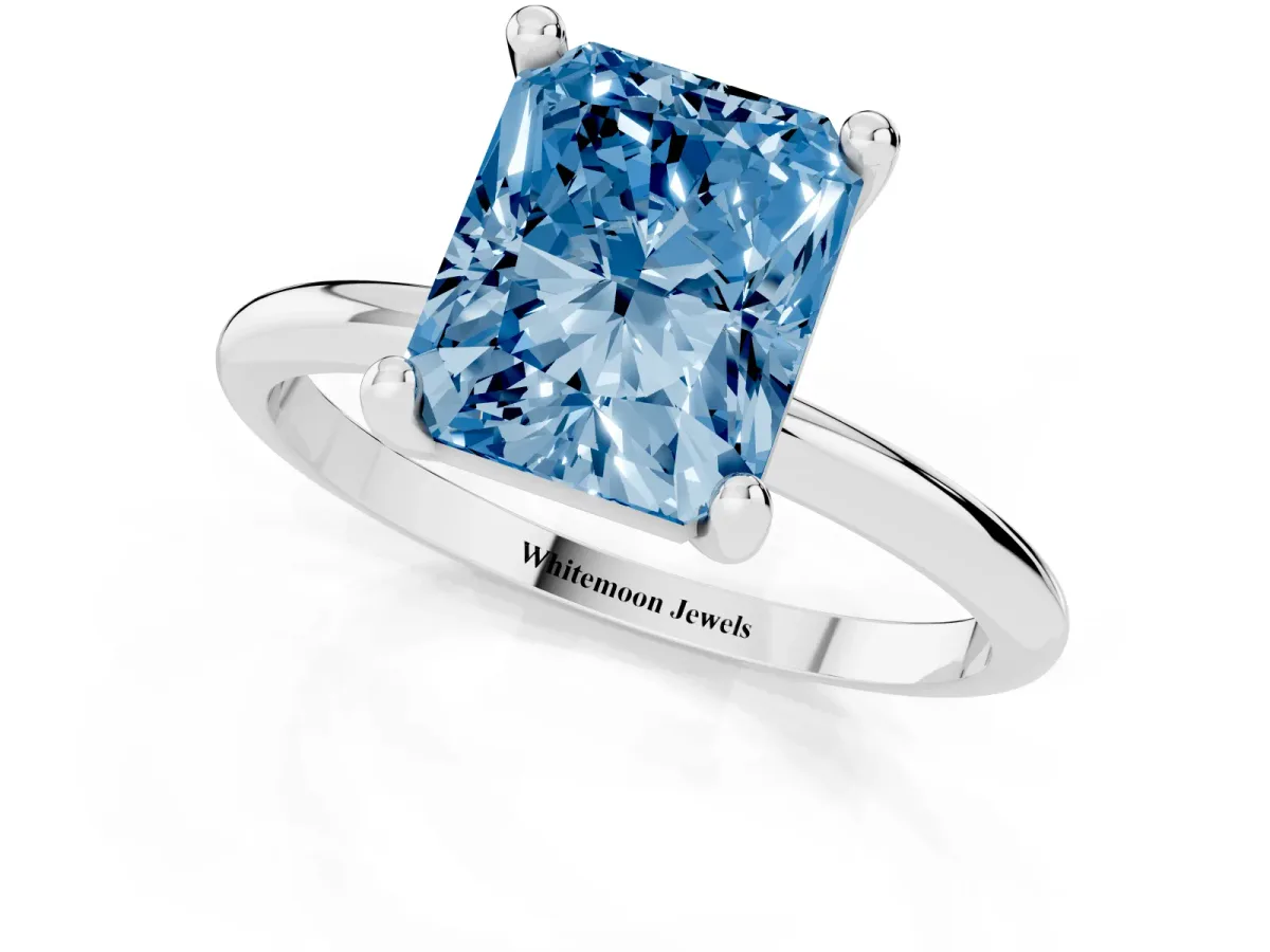 Fancy Blue Radiant Cut Solitaire Diamond Ring with 4-Prong Setting on a Classic Band Silver