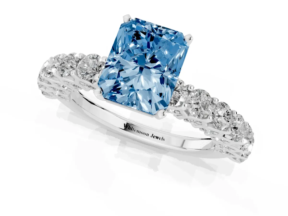 Fancy Blue Radiant Cut Diamond Solitaire Ring with Shared Prong Pavé Band and Four-Prong Setting Silver