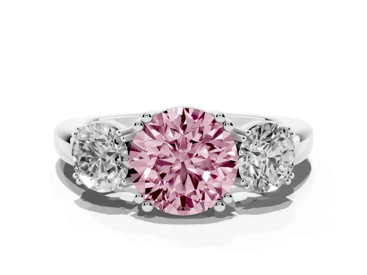 Fancy Pink Three-Stone Round Cut Cut Diamond Ring with Channel Set Band and Four-Prong Setting Silver