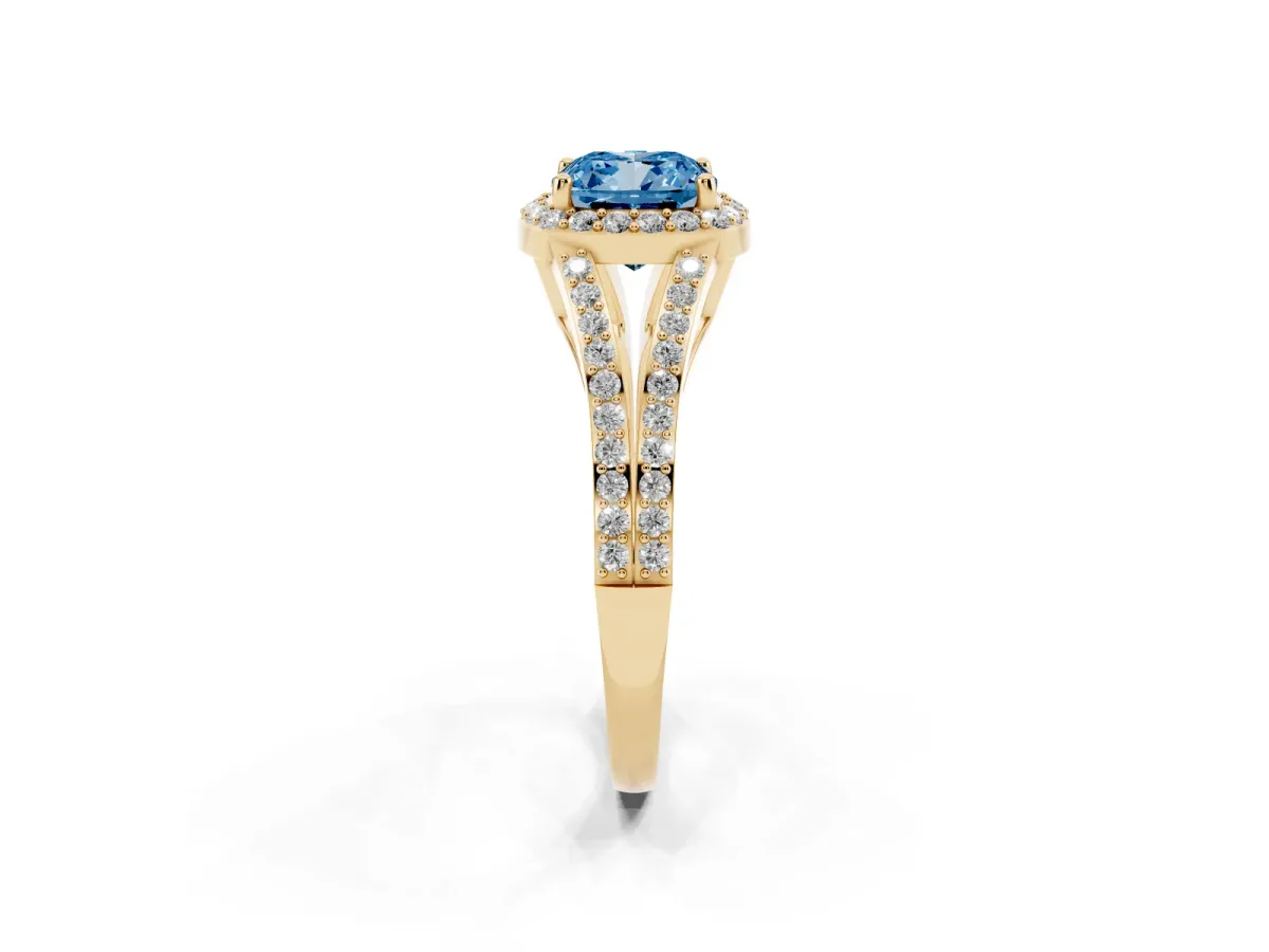Fancy Blue Cushion Cut Halo Split Shank Pave Diamond Ring with Four-Prong Setting Yellow gold