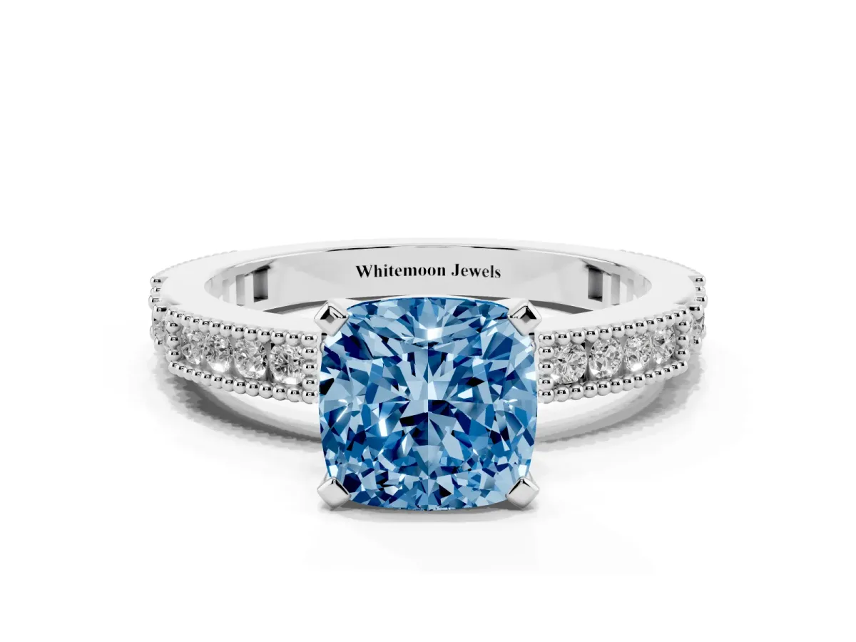 Fancy Blue Cushion Cut Solitaire with Pavé Band and Four-Prong Setting Silver