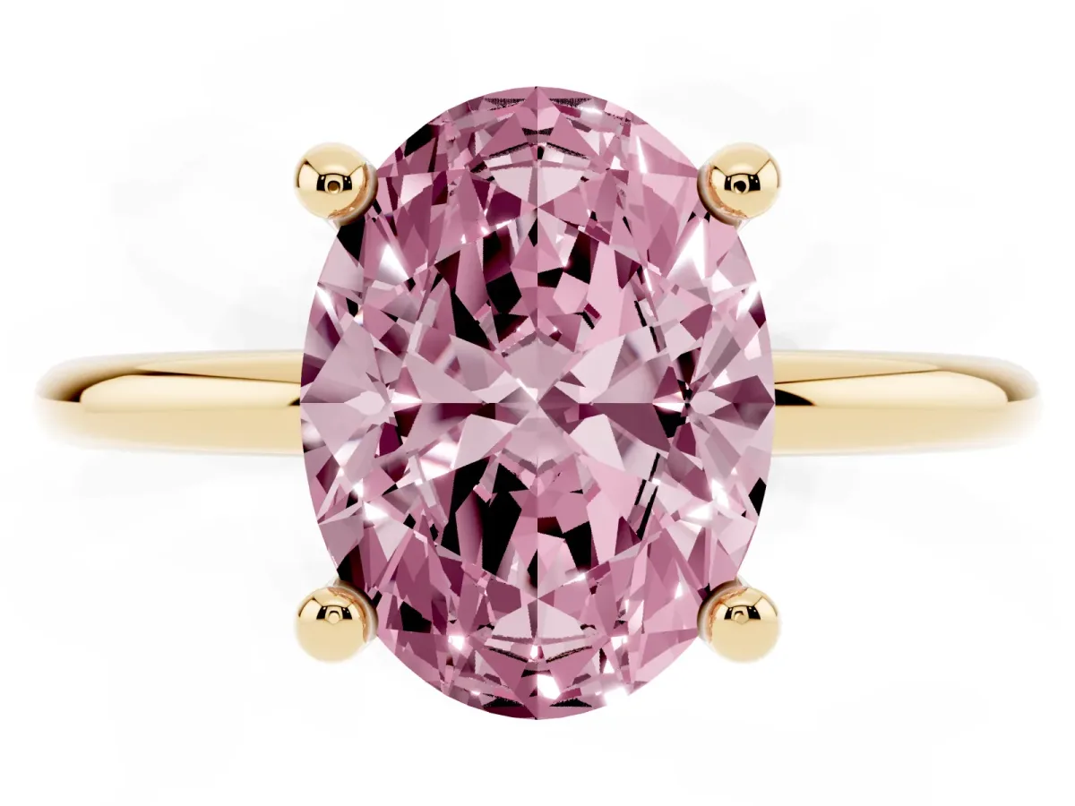 Fancy Pink Oval Cut Solitaire Diamond Ring with 4-Prong Setting on a Classic Band Yellow gold