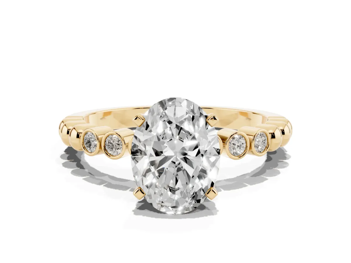 Oval Cut Solitaire Bezel Accent Diamond Engagement Ring with Beaded Band and Four-Prong Setting Yellow gold
