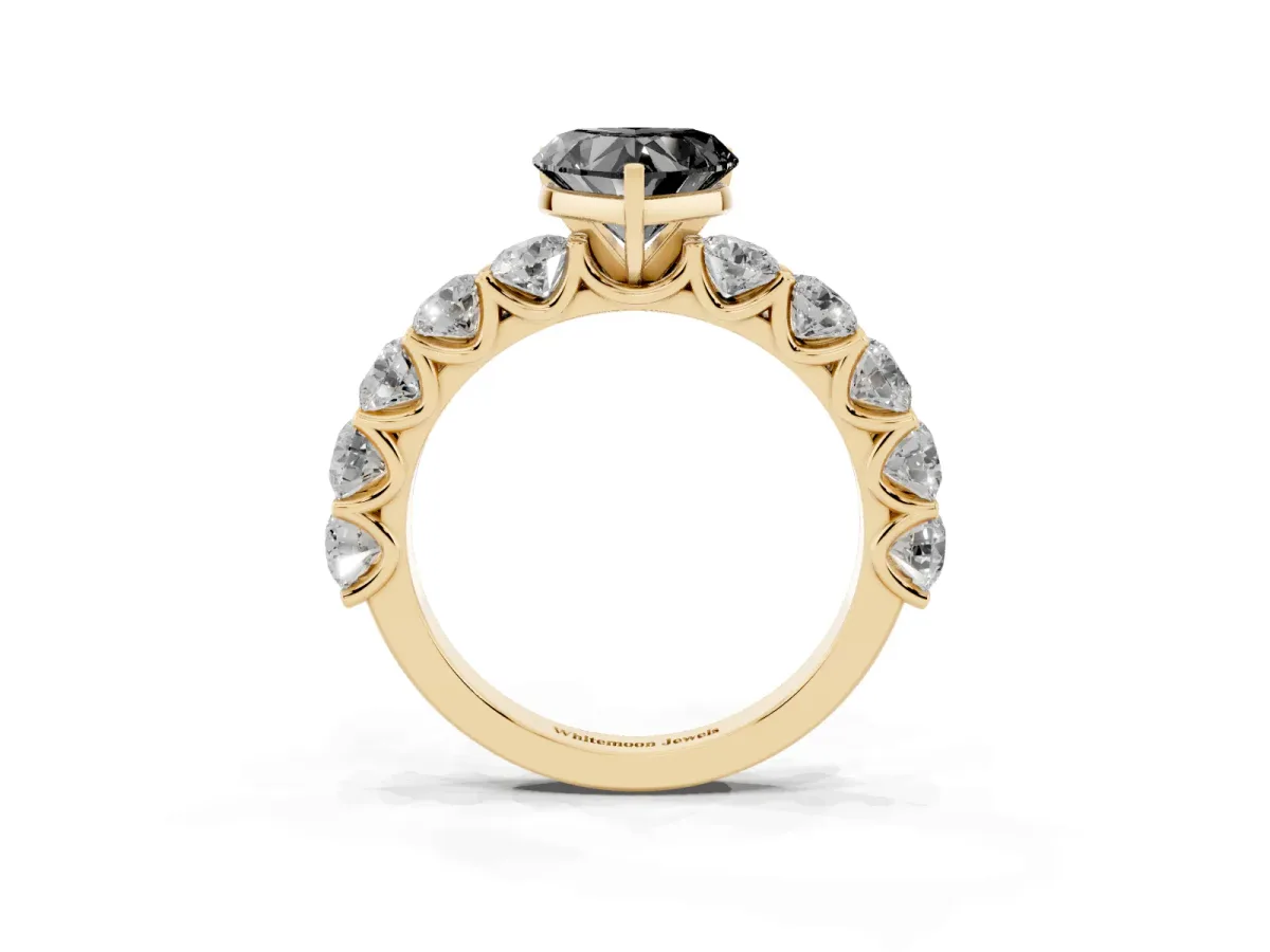 Fancy Black Heart Cut Diamond Prong Setting with Side Stones on a Pave Band Yellow gold