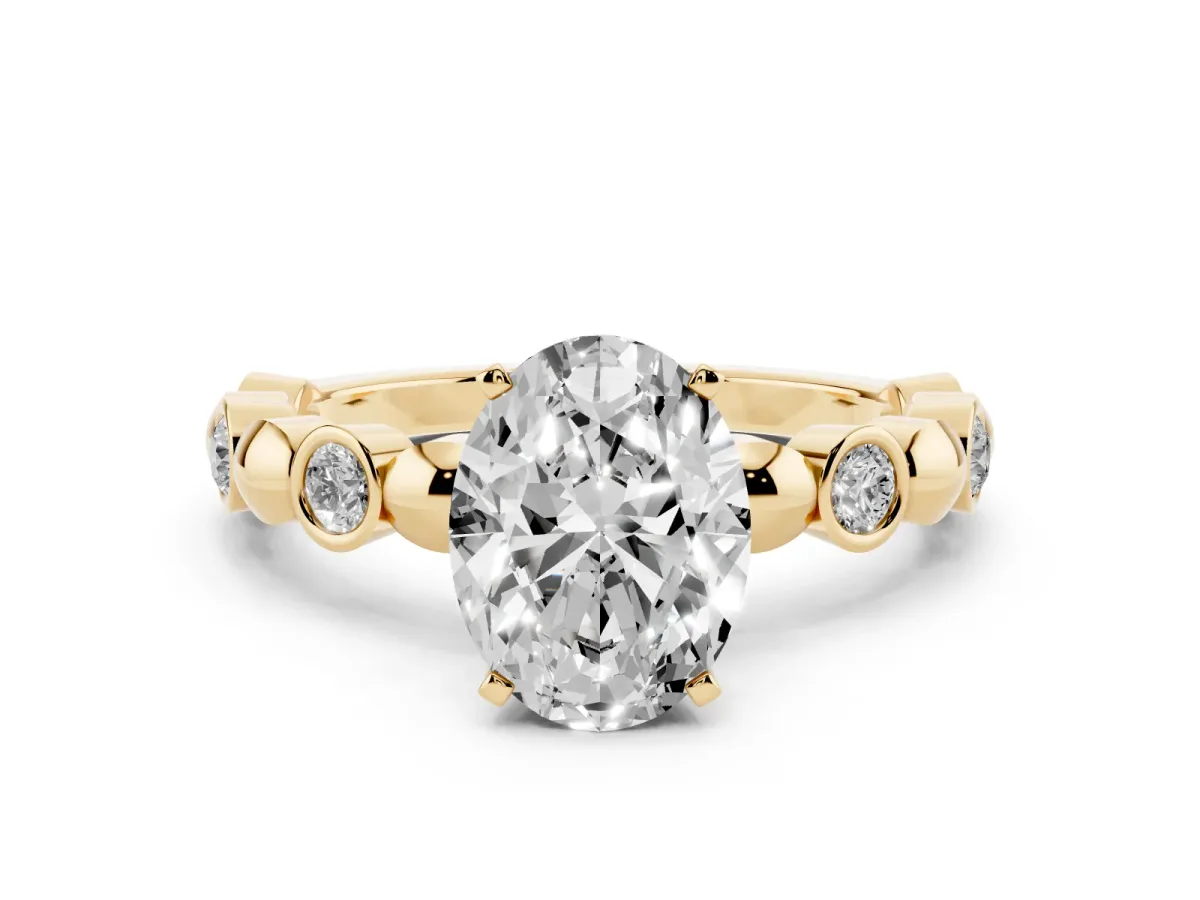 Oval Cut Solitaire Bezel-Set Diamond Ring with Beaded Band and Four-Prong Setting Yellow gold