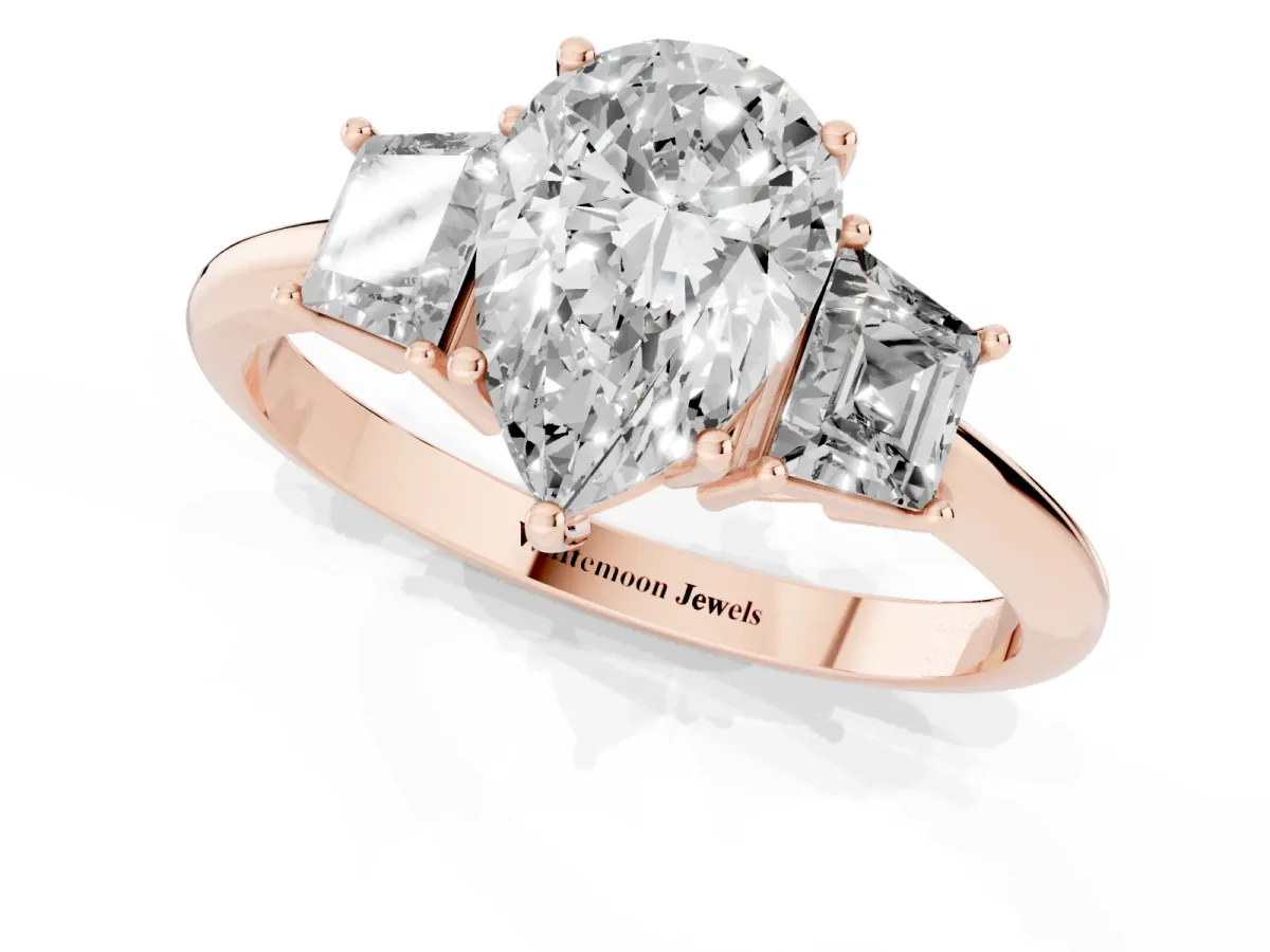 Pear Cut Diamond Three-Stone Ring with Trapezoid Side Stones and Prong Setting Rose gold
