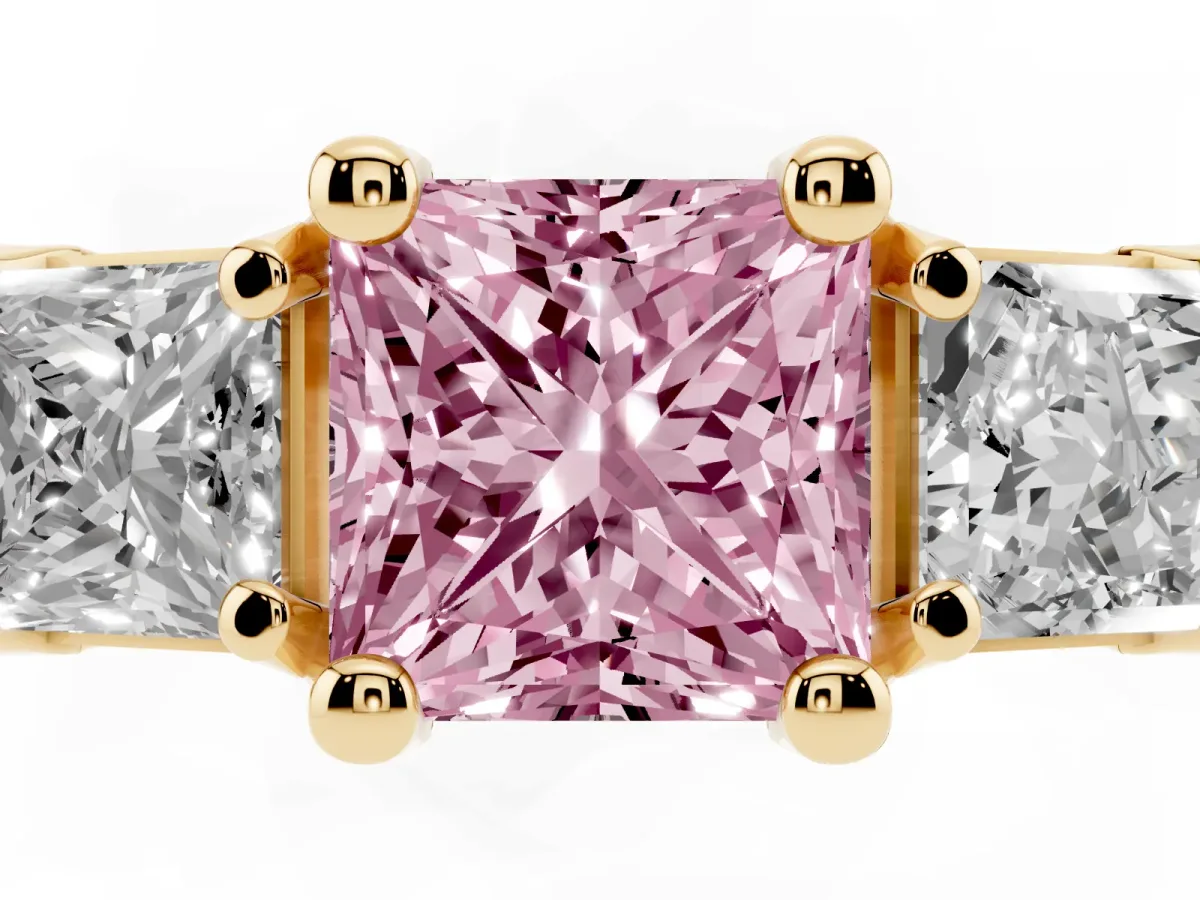 Fancy Pink Princess Cut Diamond Three-Stone Ring with Channel Set Band and Four-Prong Setting Yellow gold