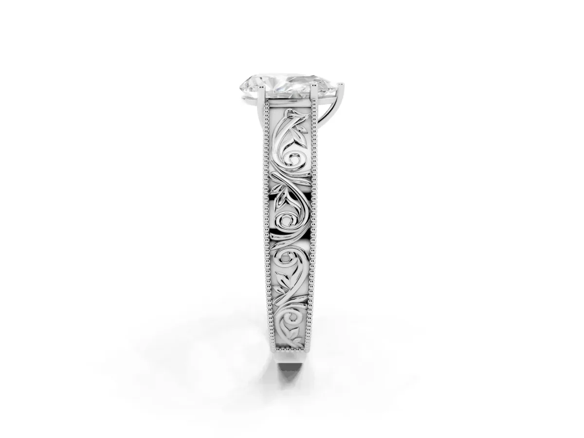 Pear Cut Diamond Solitaire Ring with Engraved Band and Four-Prong Setting Silver