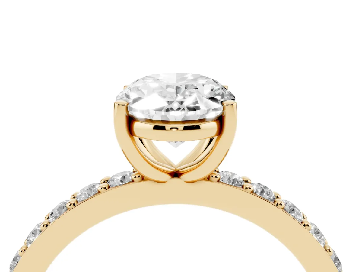 Oval Cut Cut Diamond Solitaire with Pave Band and Four-Prong Setting Yellow gold