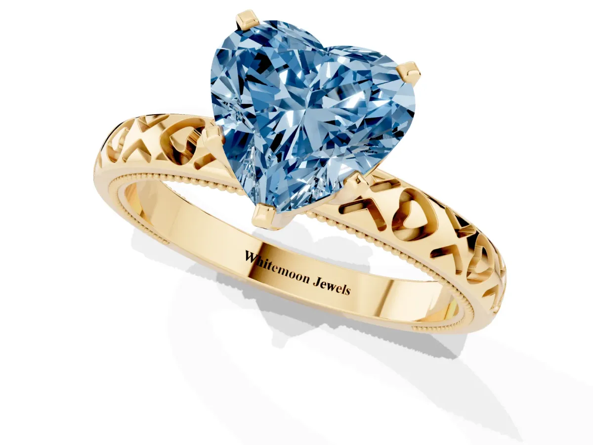 Fancy Blue Heart Cut Solitaire Diamond Engagement Ring with XO Engraved Band and Four-Prong Setting Yellow gold