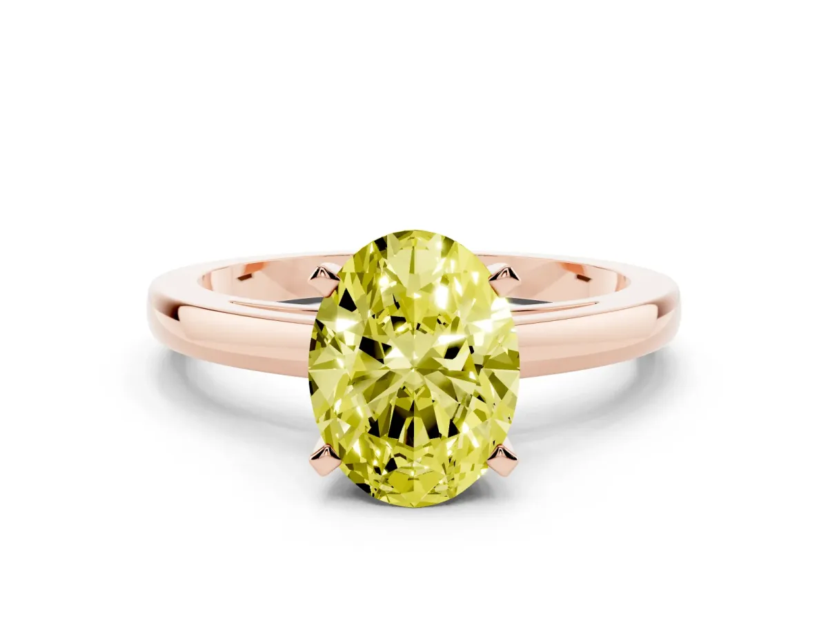 Fancy Yellow Oval Cut Solitaire Diamond Engagement Ring with Four-Prong Setting on a Classic Band Rose gold