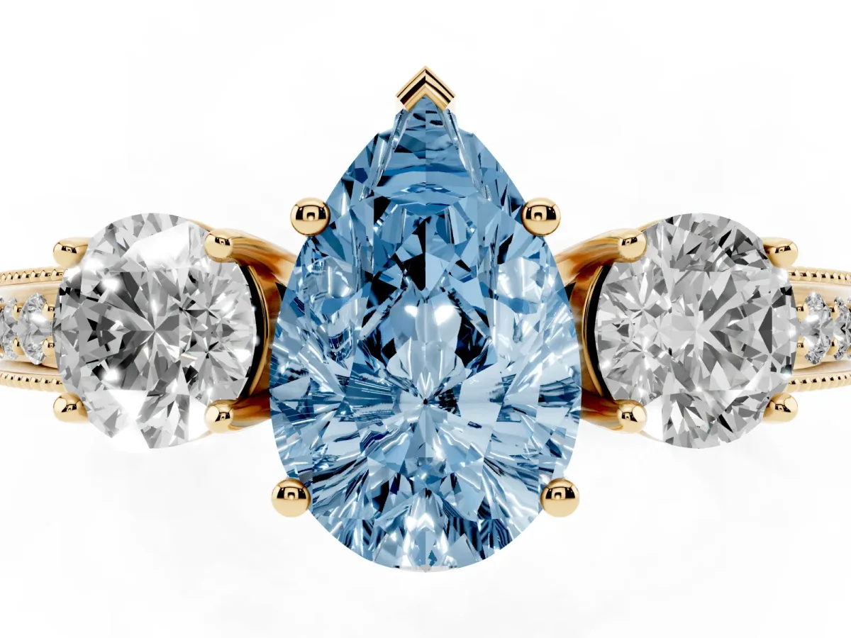 Fancy Blue Pear Cut Three-Stone Diamond Ring with Pavé Band and Four-Prong Setting Yellow gold