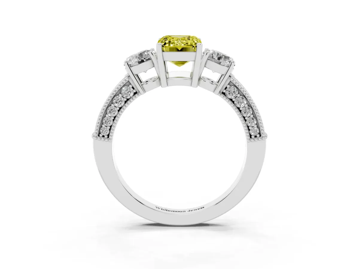 Fancy Yellow Emerald Cut Three-Stone Diamond Ring with Pavé Band and Four-Prong Setting Platinum