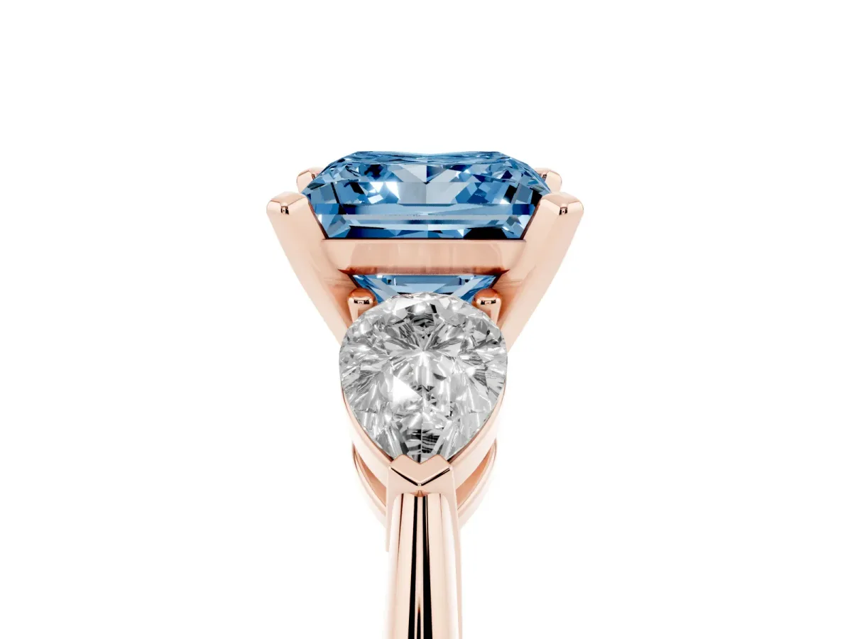 Fancy Blue Three-Stone Princess Cut Diamond Ring with Pear Side Stones and Four-Prong Setting Rose gold