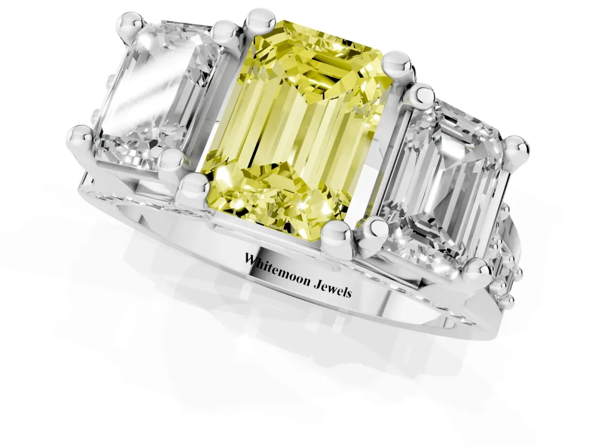 Fancy Yellow Emerald Cut Diamond Three-Stone Ring with Channel Set Band and Four-Prong Setting Platinum