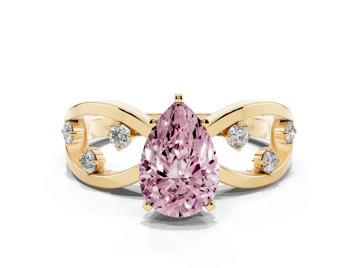 Fancy Pink Pear Cut Cut Solitaire Diamond with Side Stones on Criss-Cross Band and Four-Prong Setting Yellow gold