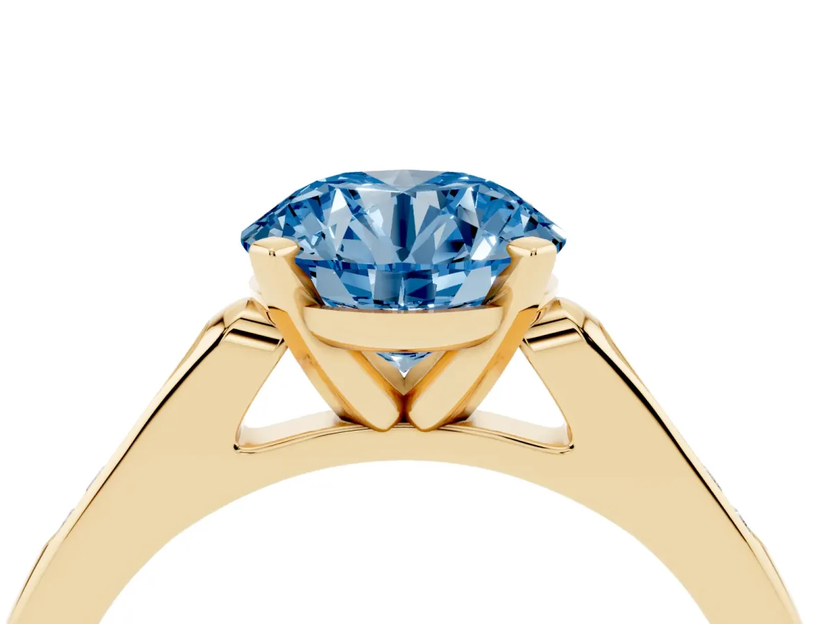 Fancy Blue Round Cut Diamond Solitaire Ring with Channel Set Round Band and Prong Setting Yellow gold