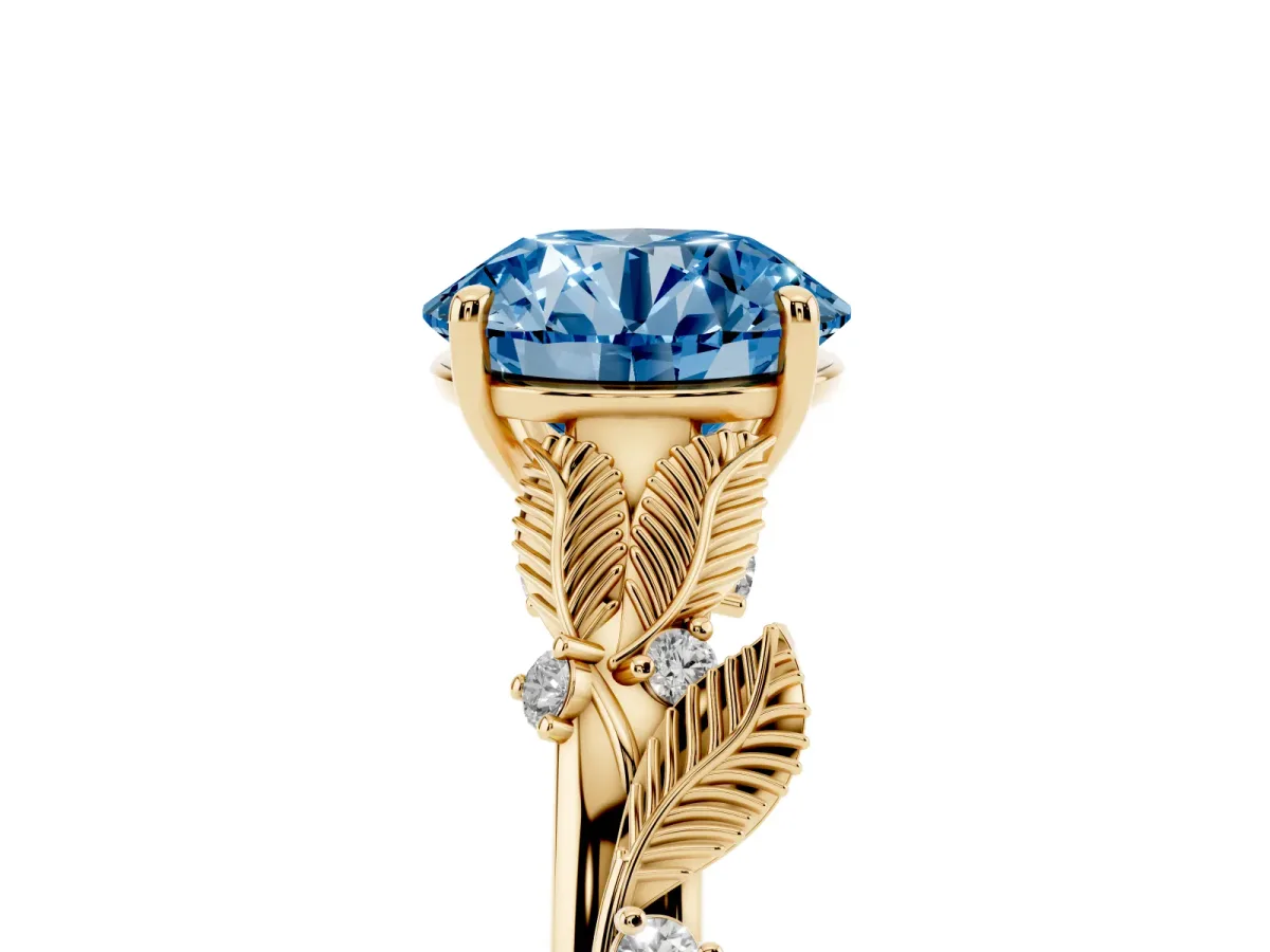 Fancy Blue Round Cut Diamond Solitaire Ring with Leaf Motif Band and Four-Prong Setting Yellow gold