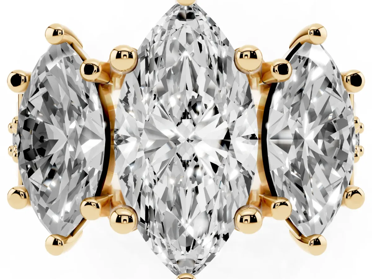 Marquise Cut Diamond Three-Stone Ring with Channel Set Band and Four-Prong Setting Yellow gold