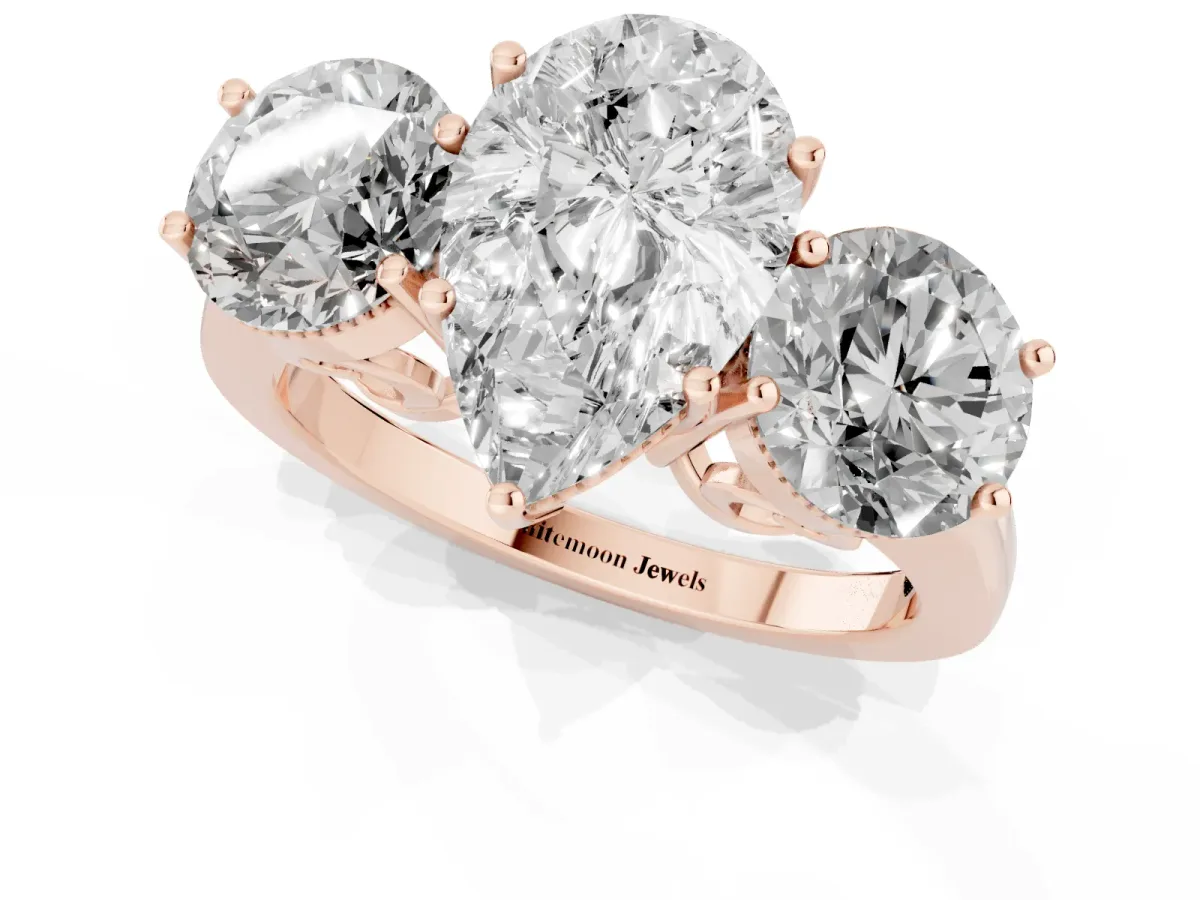 Three-Stone Pear Cut Diamond Engagement Ring with Prong Setting on a Classic Band Rose gold
