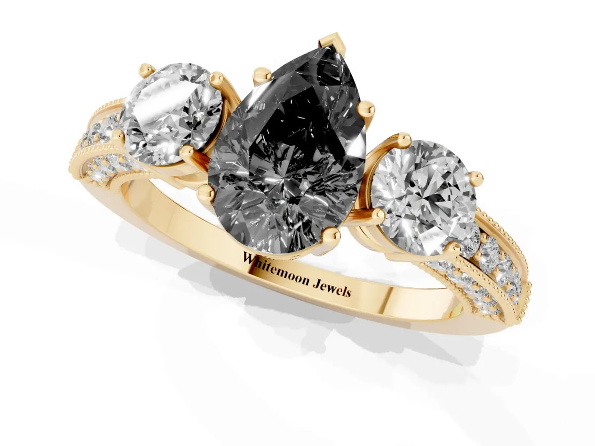 Fancy Black Pear Cut Three-Stone Diamond Ring with Pavé Band and Four-Prong Setting Yellow gold