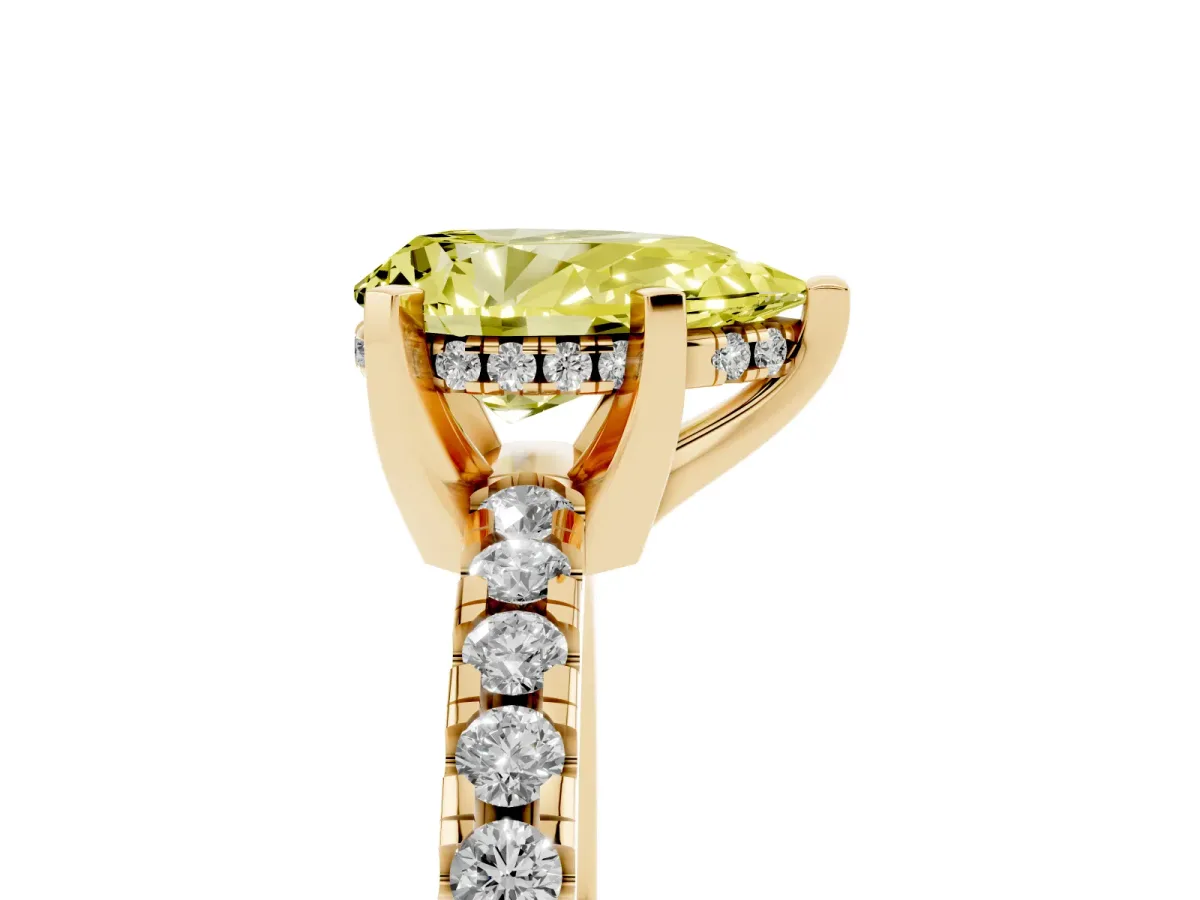 Fancy Yellow Pear Cut Diamond Solitaire Ring with Round Pavé Band and Four-Prong Setting Yellow gold
