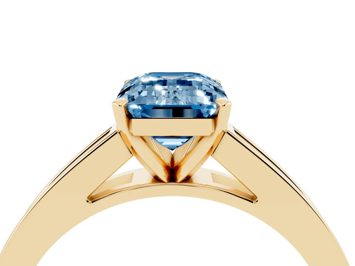 Fancy Blue Emerald Cut Solitaire Diamond Ring with Channel-Set Band and Four-Prong Setting Yellow gold