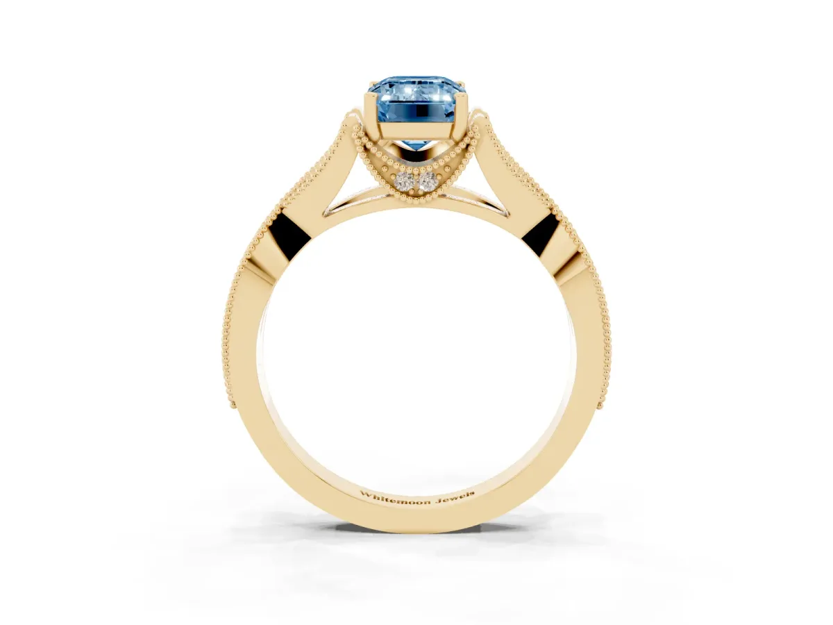 Fancy Blue Emerald Cut Cut Diamond Twisted Band with Milgrain Pave Setting and Four-Prong Setting Yellow gold