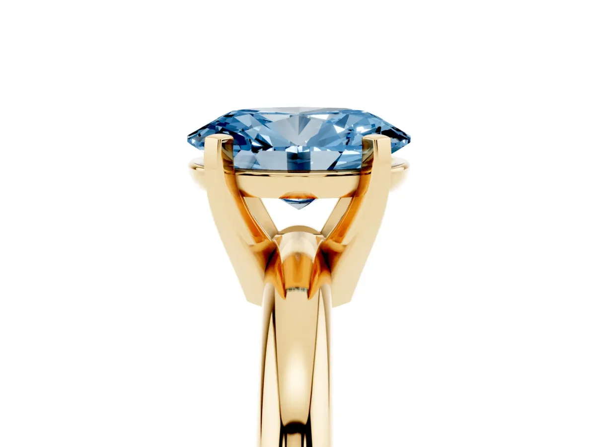 Fancy Blue Oval Cut Diamond Solitaire Engagement Ring with Round Band and Four-Prong Setting Yellow gold