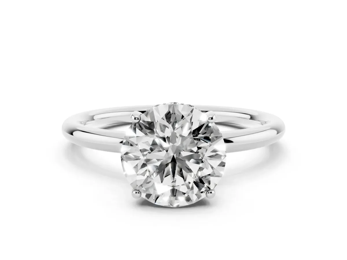 Round Cut Solitaire Diamond Ring with a Classic Band and Four-Prong Setting Platinum