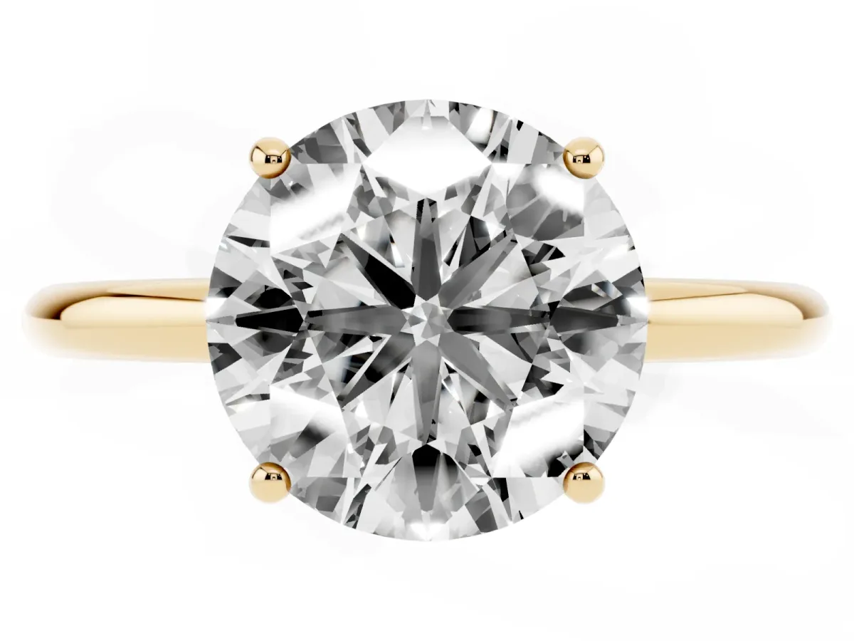 Round Cut Solitaire Diamond Ring with a Classic Band and Four-Prong Setting Yellow gold