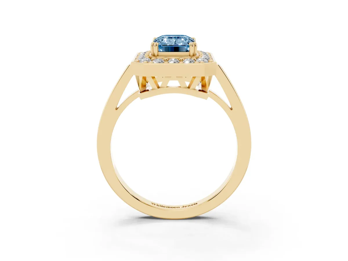 Fancy Blue Emerald Cut Diamond Halo Ring with Split Shank and Four-Prong Setting Yellow gold