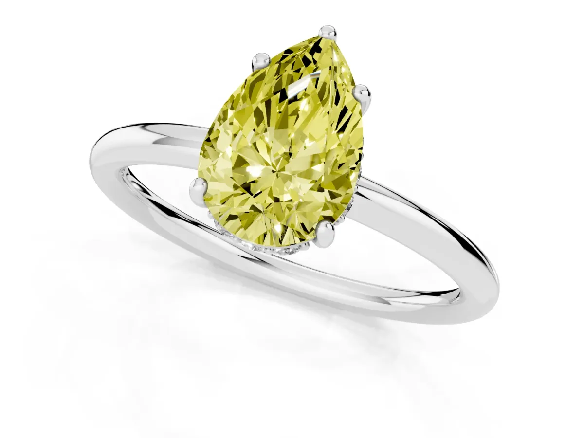 Fancy Yellow Pear Cut Solitaire Diamond Ring with a Classic Band and Four-Prong Setting Silver
