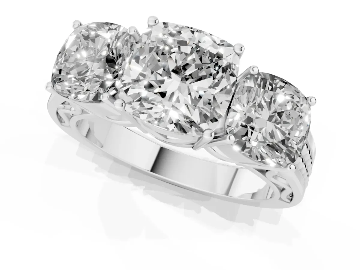 Cushion Cut Diamond Three-Stone Ring with Prong Setting and Textured Band Platinum