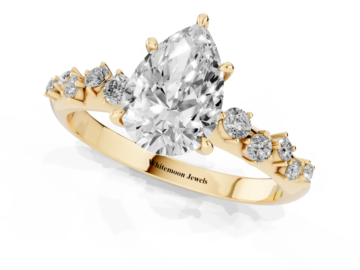 Pear Cut Diamond Cluster Side Stone Solitaire Ring with Prong Setting Yellow gold