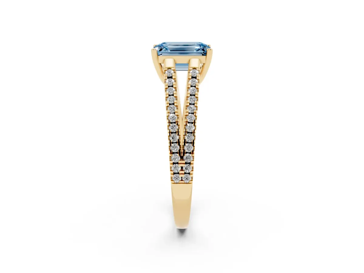 Fancy Blue Emerald Cut Diamond Solitaire Engagement Ring with Split Shank Pavé Band Yellow gold
