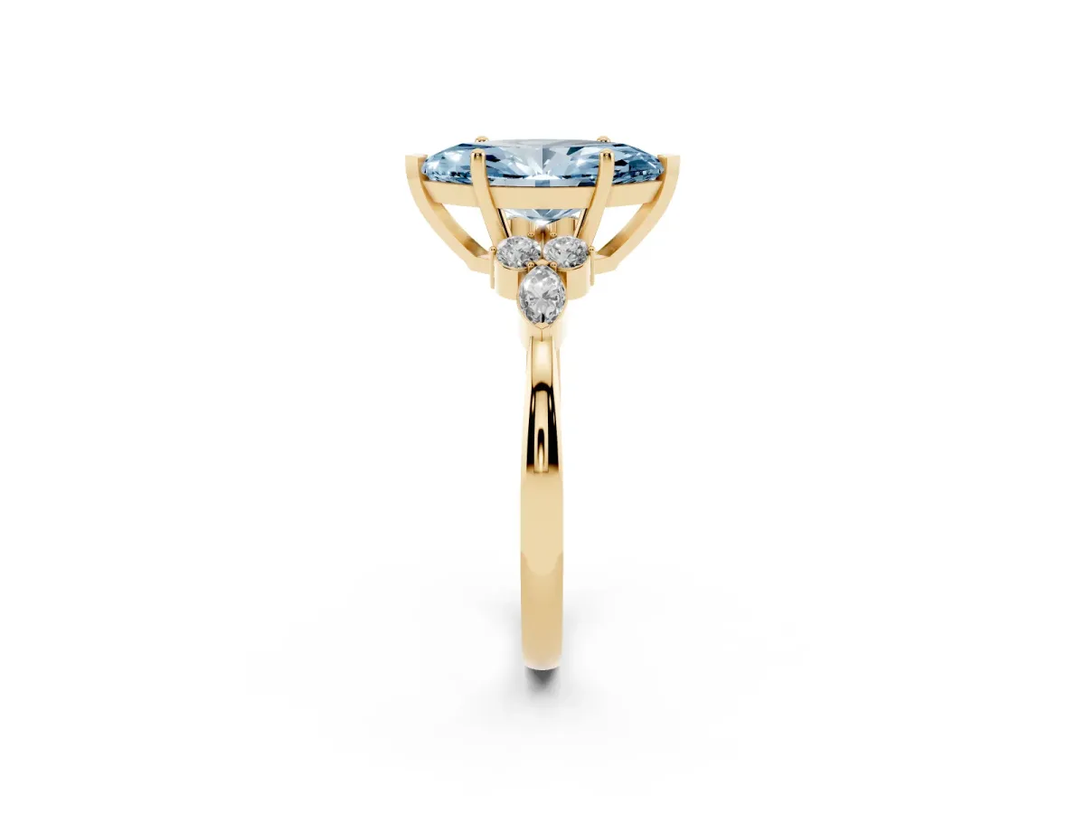 Fancy Blue Marquise Cut Brilliant Diamond Solitaire Ring with Pear Side Stones and Four-Prong Setting Yellow gold