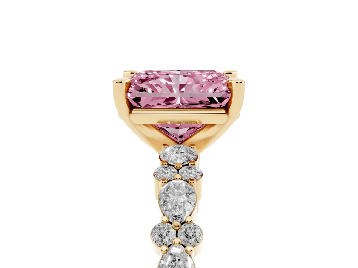 Fancy Pink Radiant Cut Diamond Side Stone Solitaire Ring with Round and Four-Prong Setting Yellow gold
