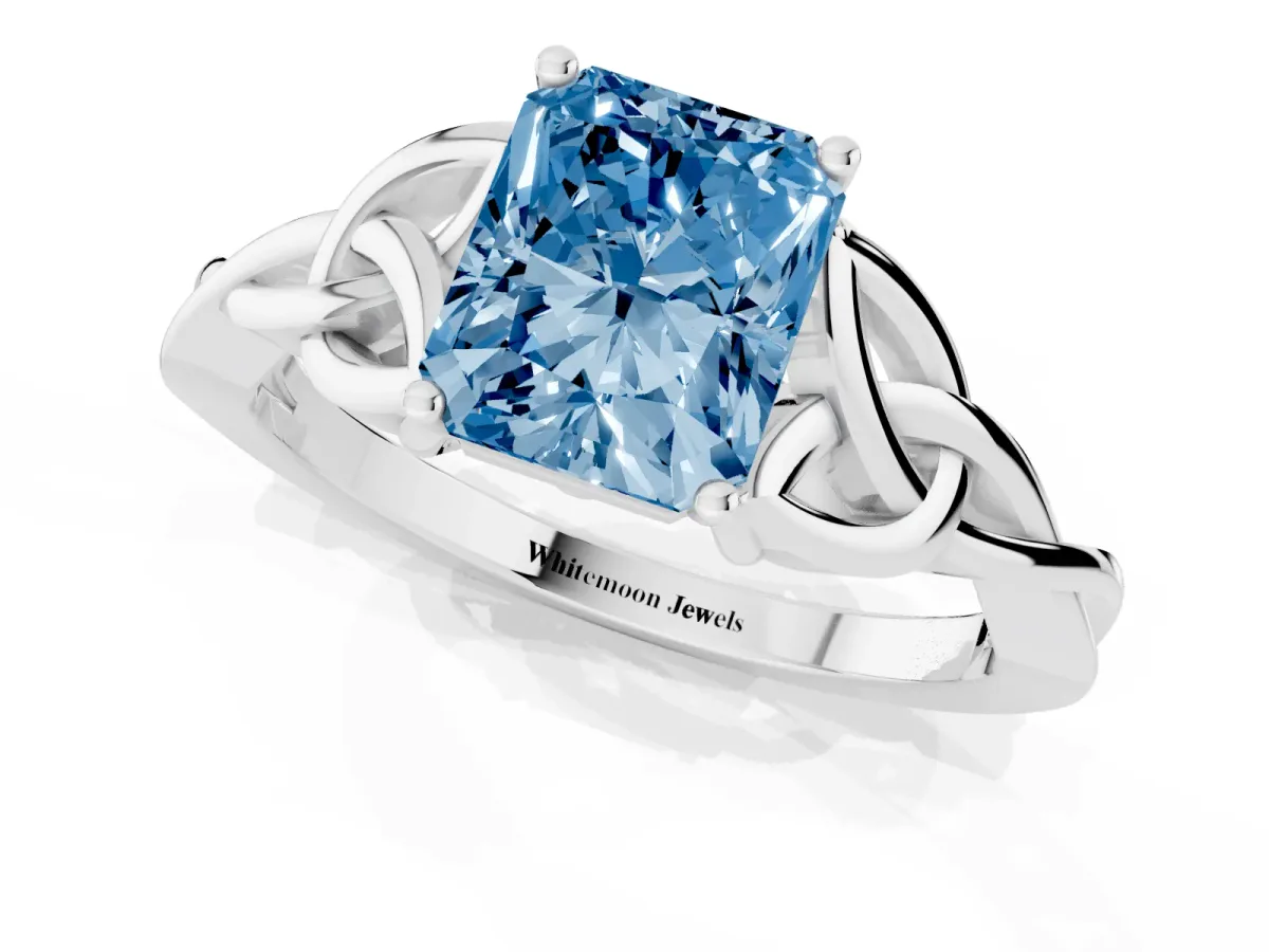 Fancy Blue Radiant Cut Diamond Solitaire Engagement Ring with Celtic Knot Band and Four-Prong Setting White gold