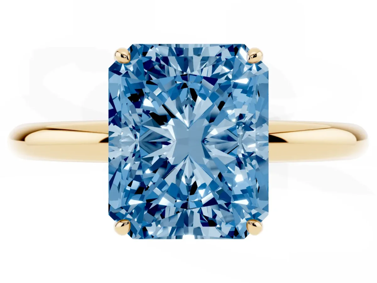 Fancy Blue Radiant Cut Solitaire Diamond Ring with Four-Prong Setting on a Plain Band Yellow gold