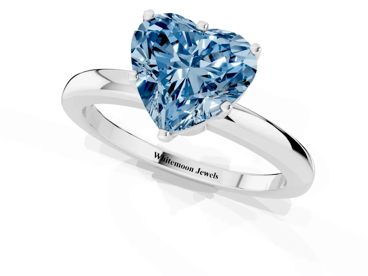 Fancy Blue Heart Cut Solitaire Diamond Ring with Six-Prong Setting on a Classic Band Platinum