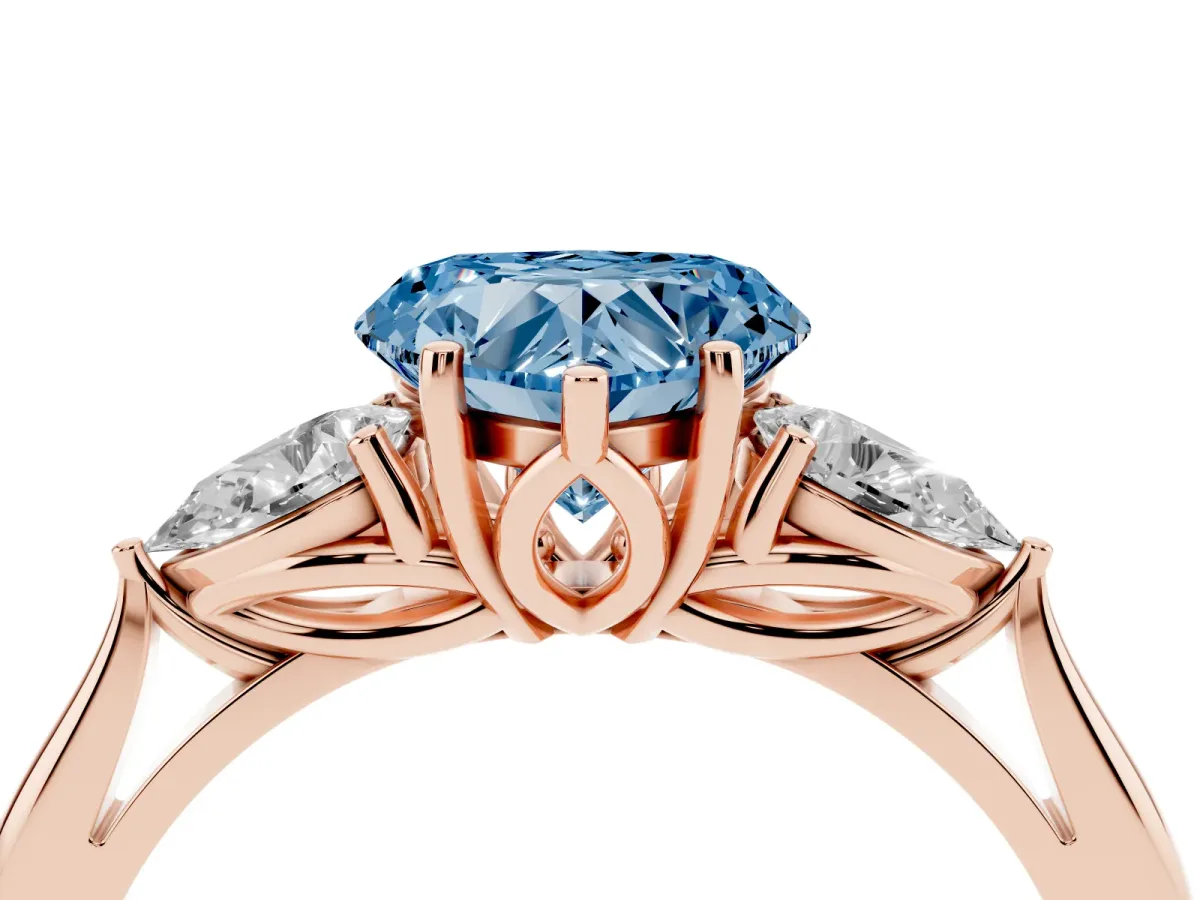 Fancy Blue Heart Cut Diamond Three-Stone Ring with Pear Side Stones and Prong Setting Rose gold