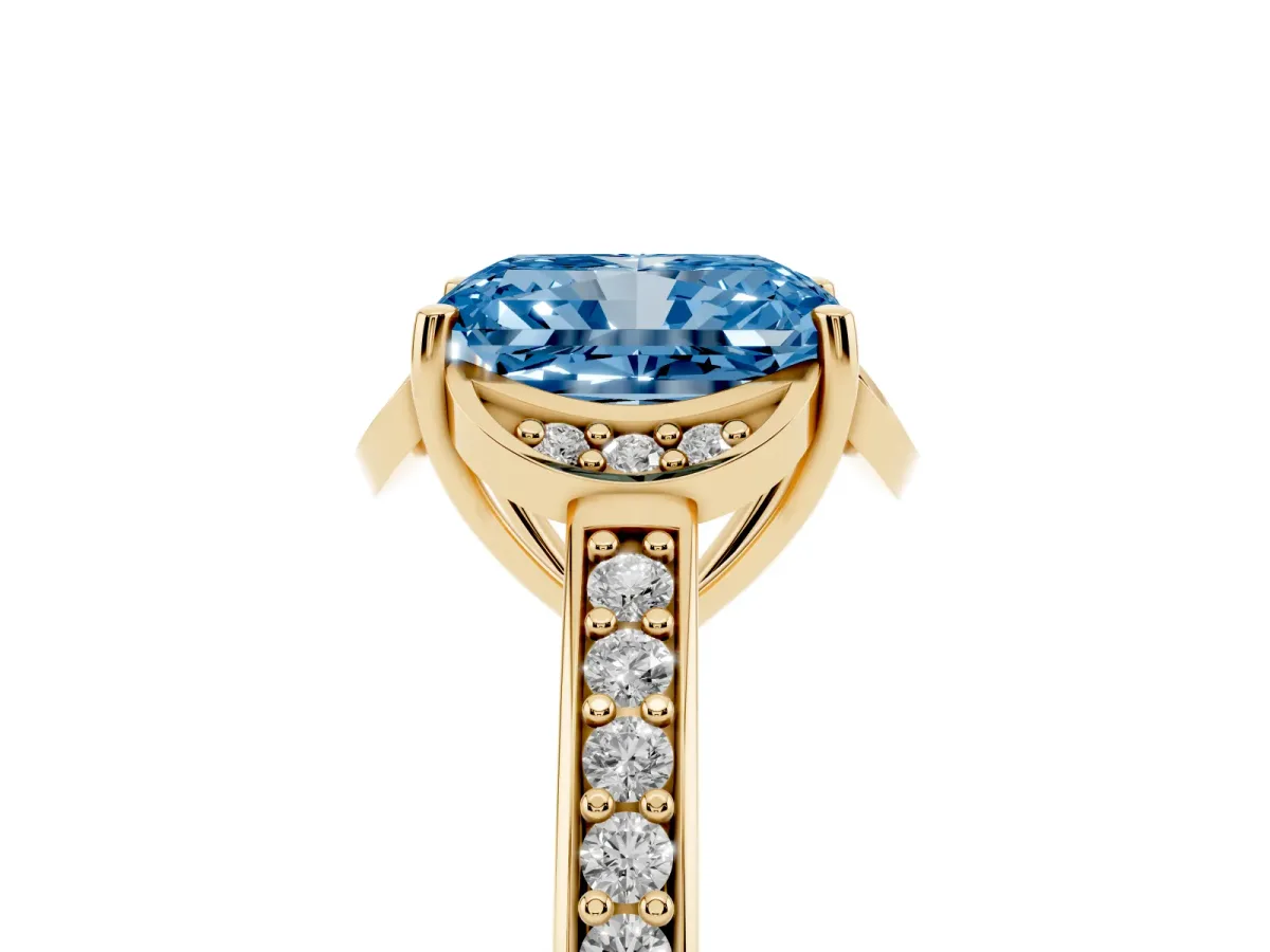 Fancy Blue Radiant Cut Cut Halo Diamond Ring with Channel Set Band and Four-Prong Setting Yellow gold