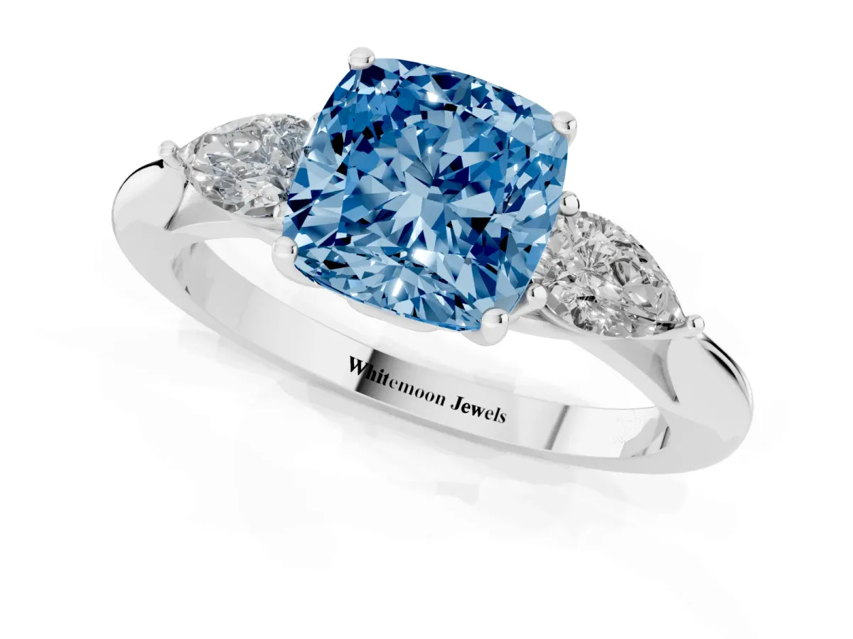 Fancy Blue Three-Stone Cushion Cut Diamond Ring with Pear Side Stones in Four-Prong Setting Silver